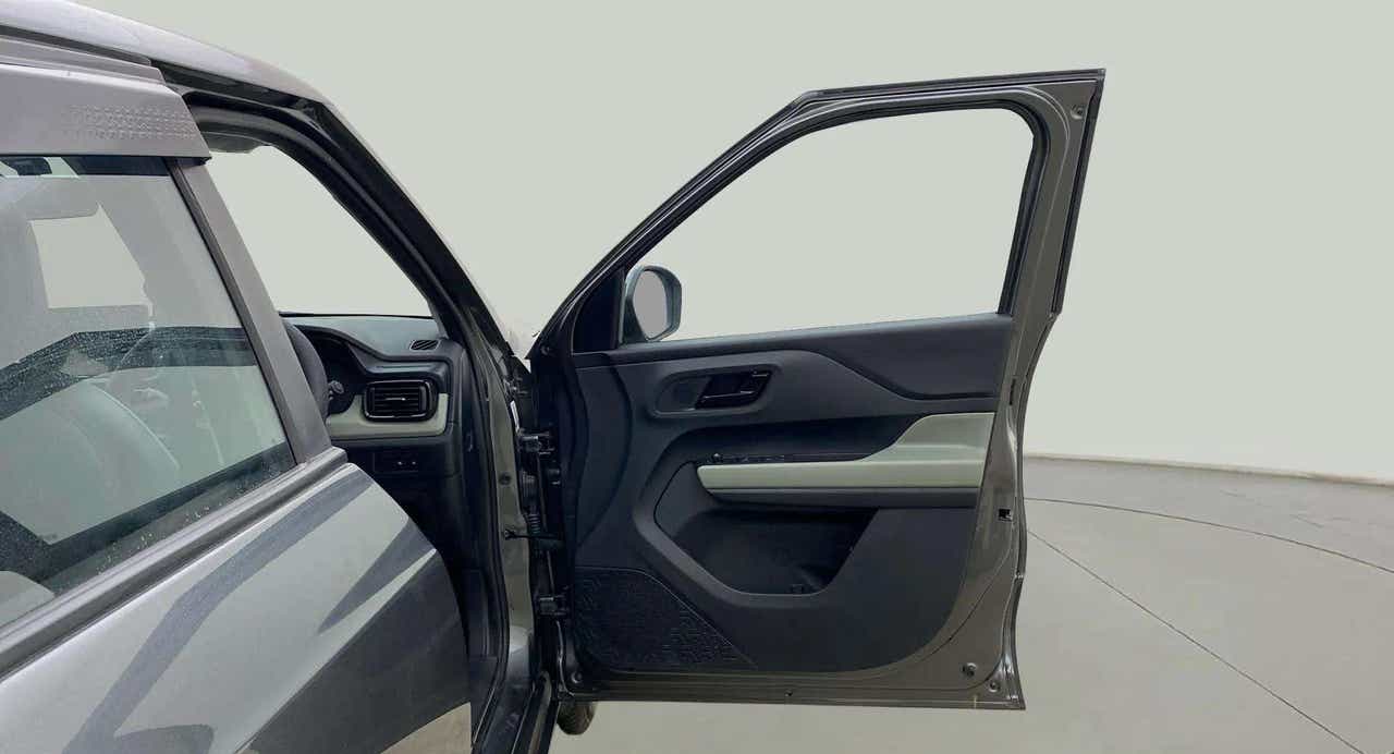 Front driver side door and partial dashboard of a Tata Punch