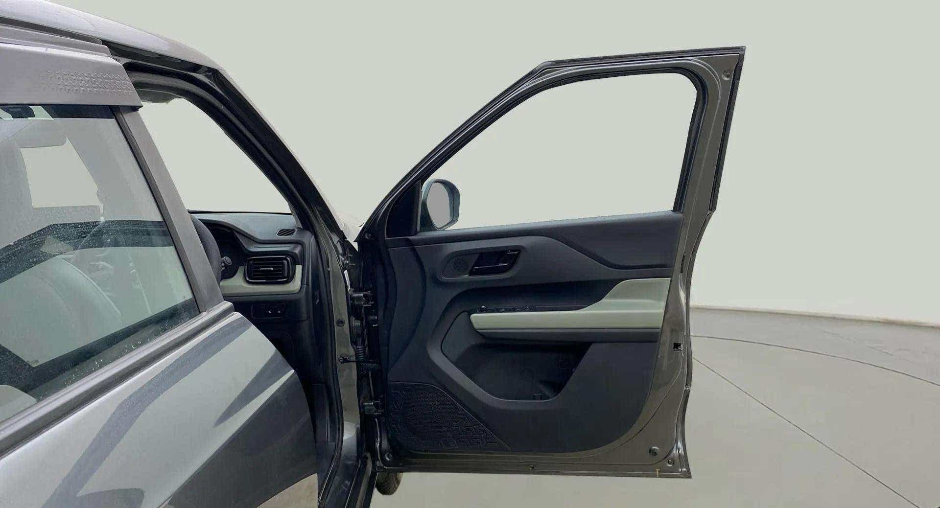 Front driver side door and partial dashboard of a Tata Punch