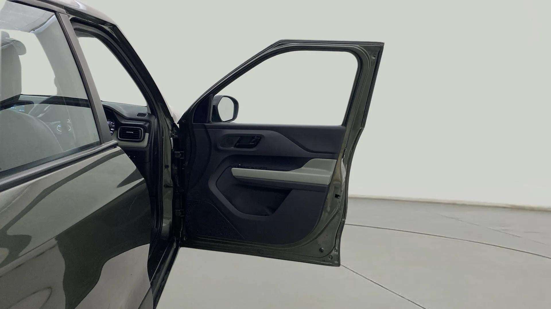 Front driver side door open view of a Tata Punch