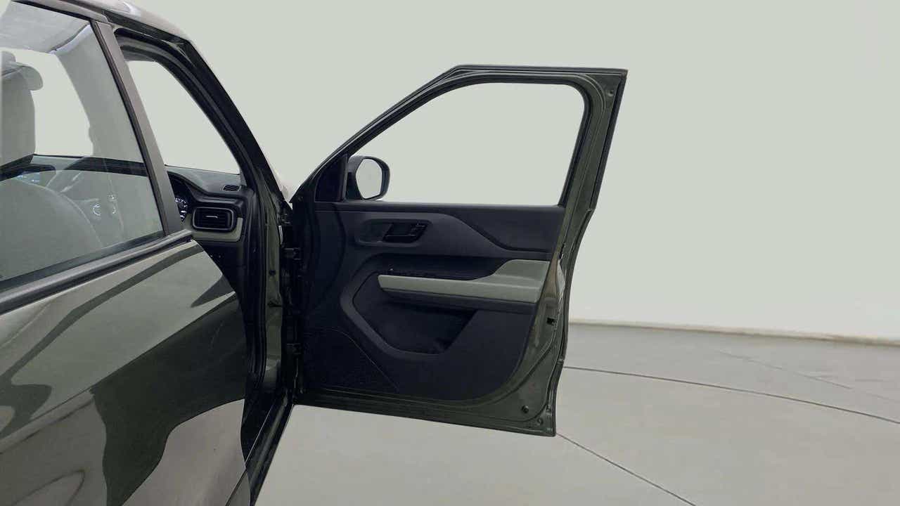 Front driver side door open view of a Tata Punch