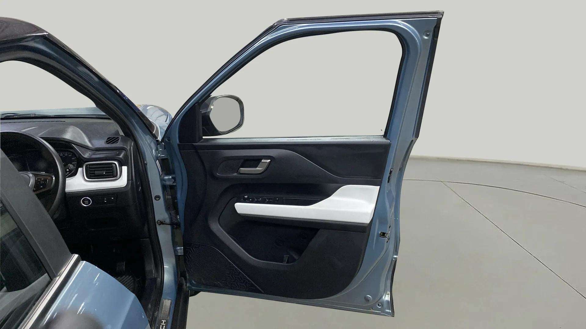 Driver side door and dashboard of a Tata Punch