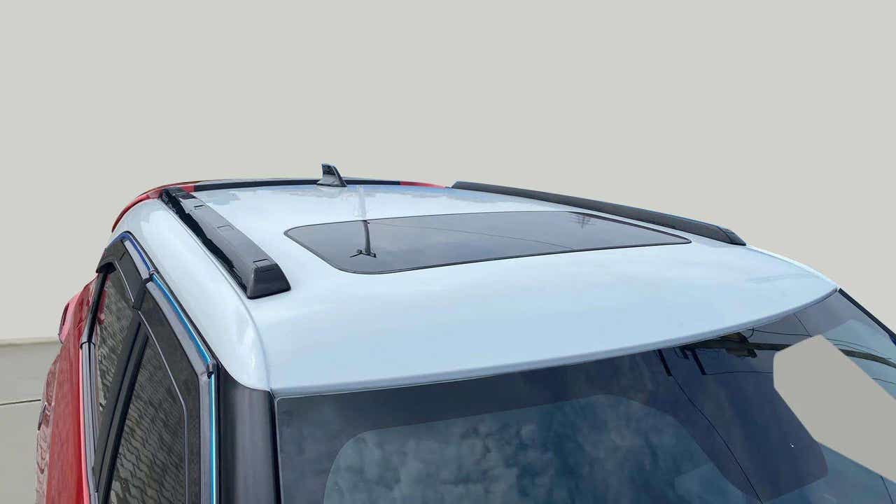 Sunroof and roof rails view of a Calypso Red with White Roof Tata Punch