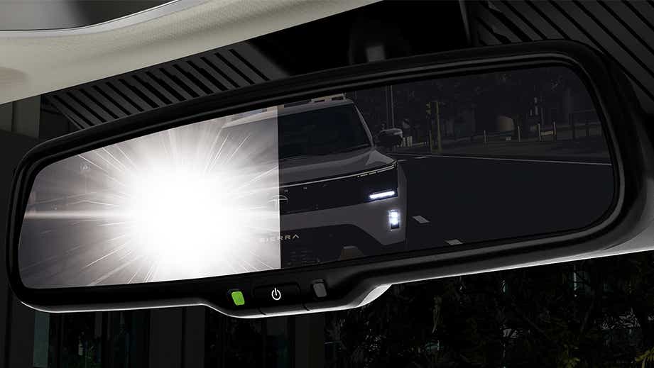 Rearview mirror view of a Tata Sierra