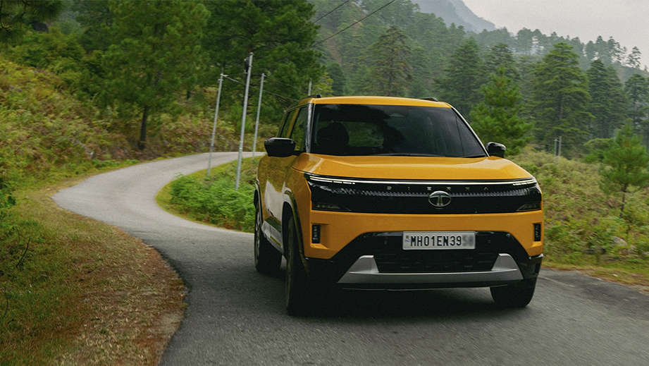 Front view of a Tata Sierra on a winding road