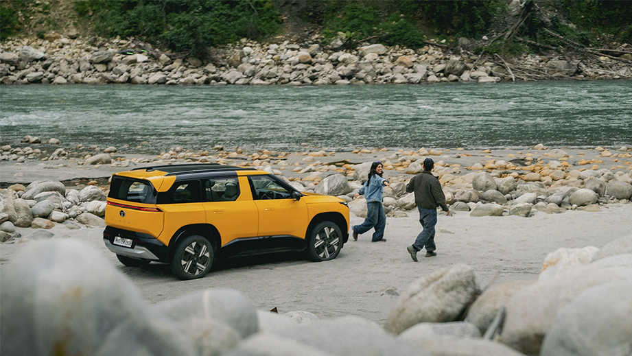 Side view of a andaman adventure Tata Sierra near a riverbank