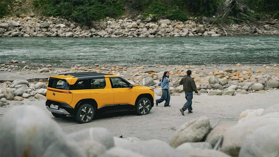 Side view of a andaman adventure Tata Sierra near a riverbank
