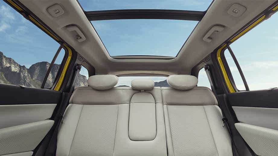 Interior rear seat and sunroof view of a Tata Sierra