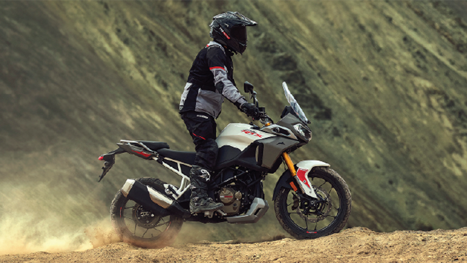 Side view of a pearl white TVS Apache RTX dual-sport motorcycle