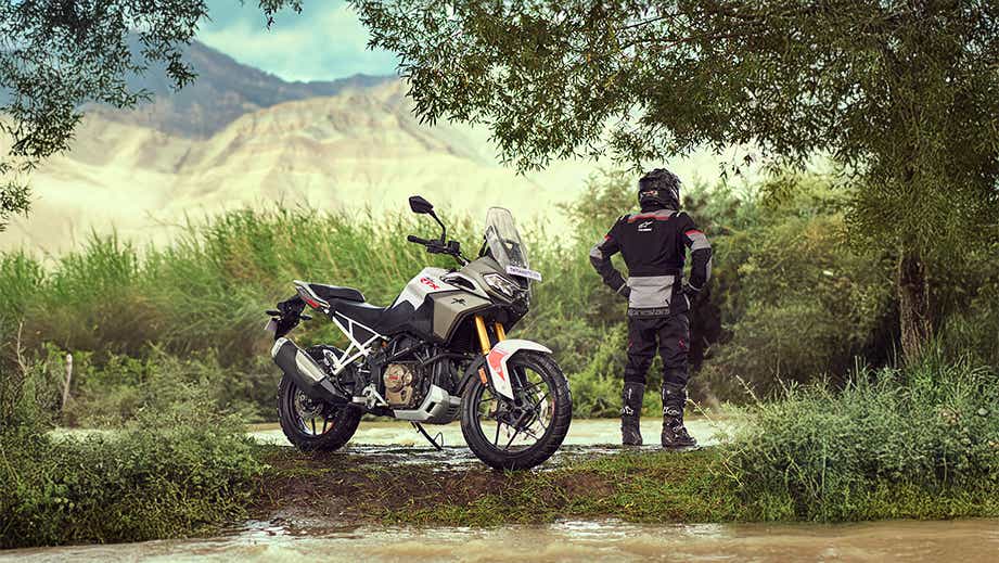 Side view of a tarn bronze TVS Apache RTX motorcycle outdoors