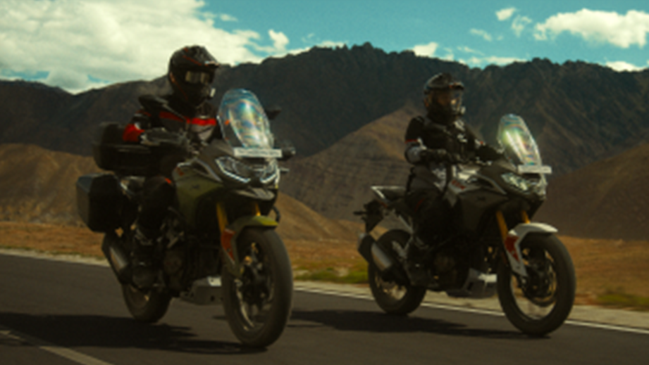 Front view of a TVS Apache RTX duo on an open road