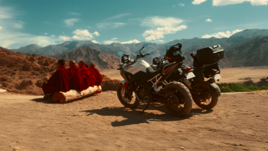 Side view of a TVS Apache RTX motorcycle in the mountains