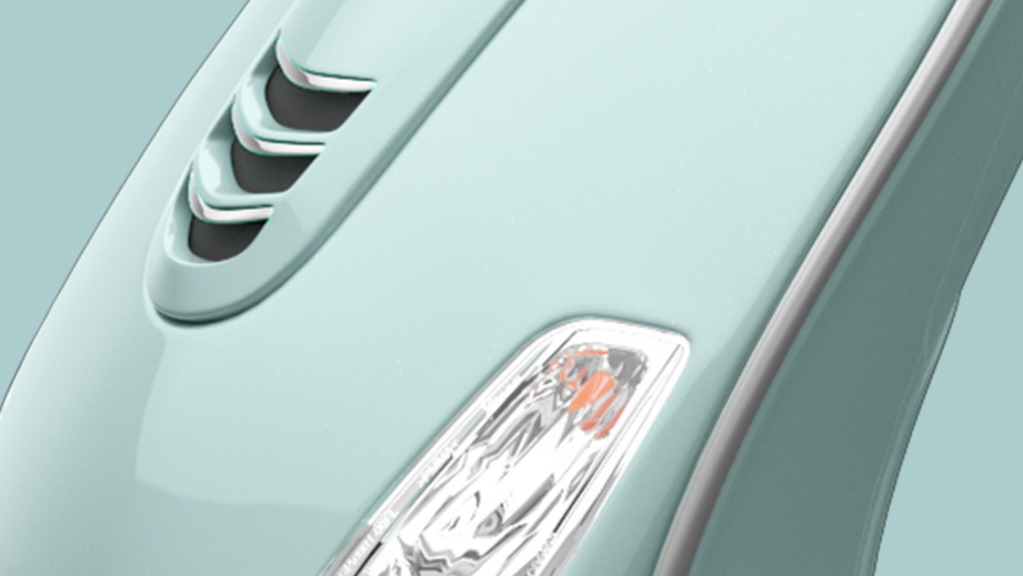 Close-up of the front fender and headlight of Vespa