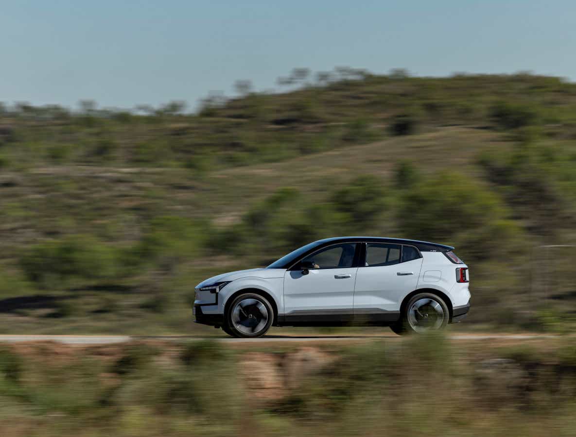 Side view of a crystal white Volvo EX30