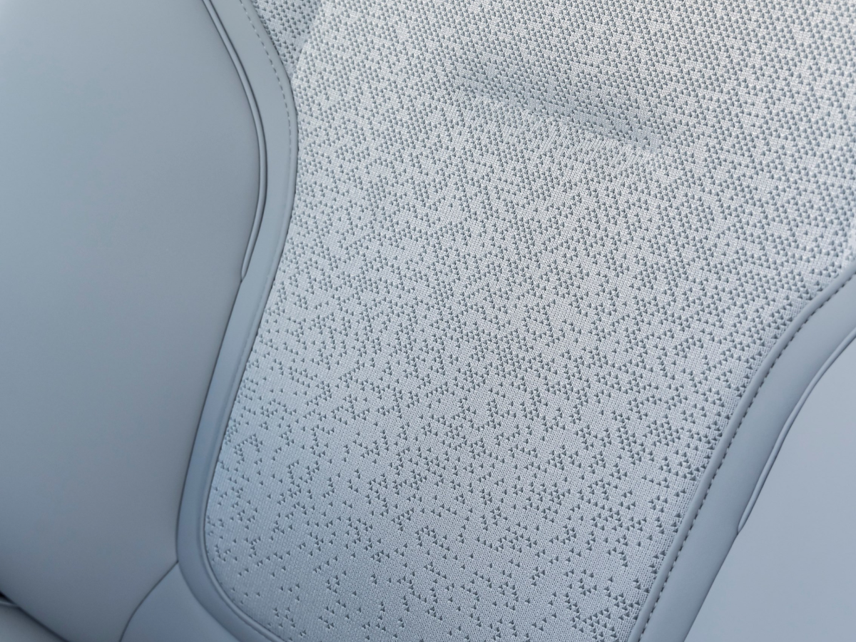 Close-up of a Crystal White Volvo EX30 seat upholstery