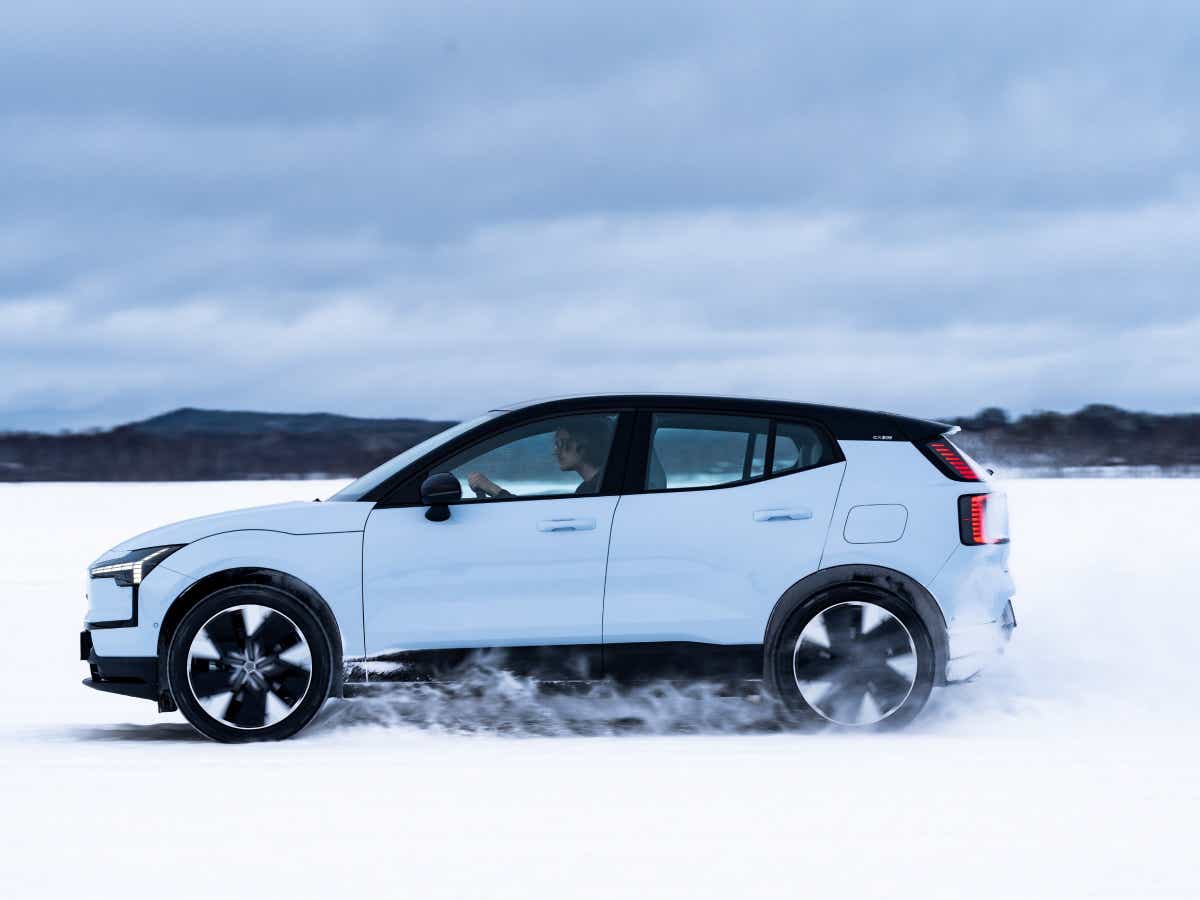 Side view of a crystal white Volvo EX30