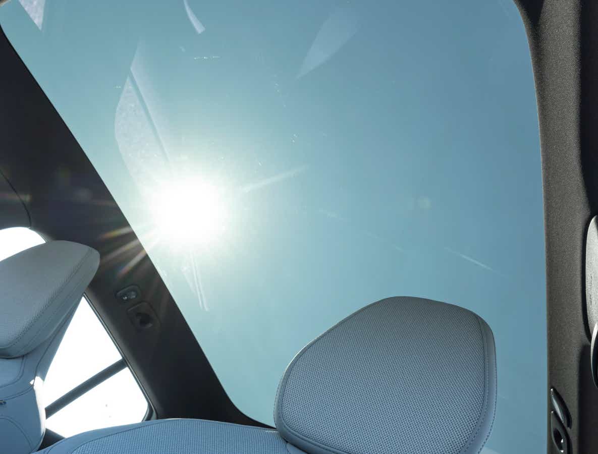 Panoramic glass roof view from inside a Volvo EX30