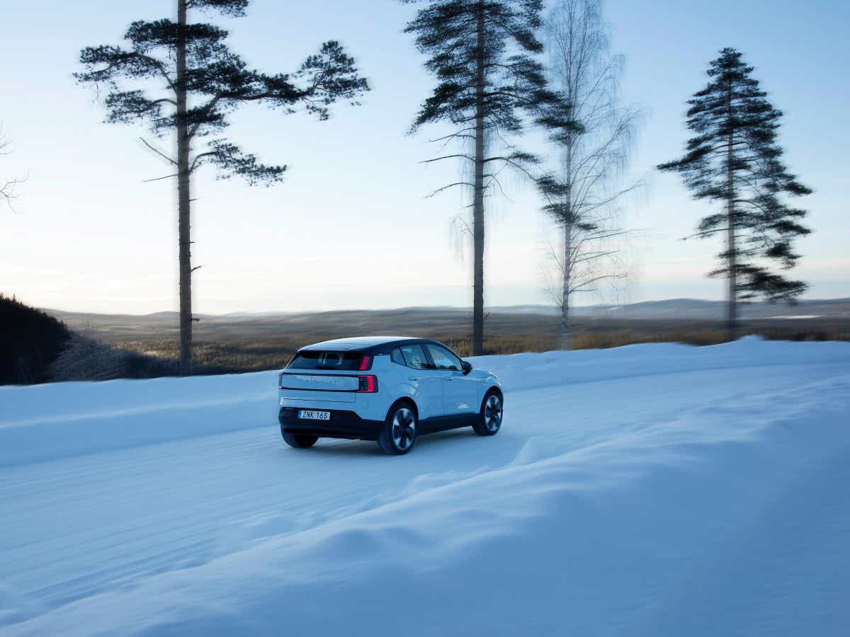 Rear three-quarter view of a cold blue Volvo EX30