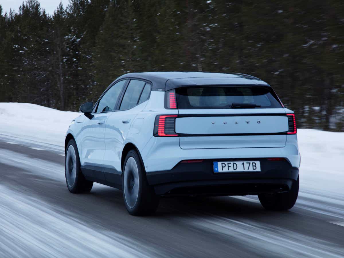 Rear three-quarter view of a cold blue Volvo EX30