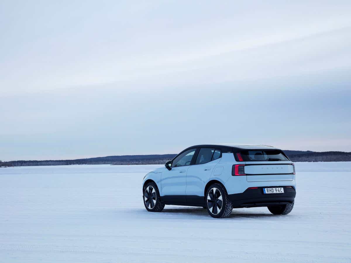 Rear three-quarter view of a cold blue Volvo EX30