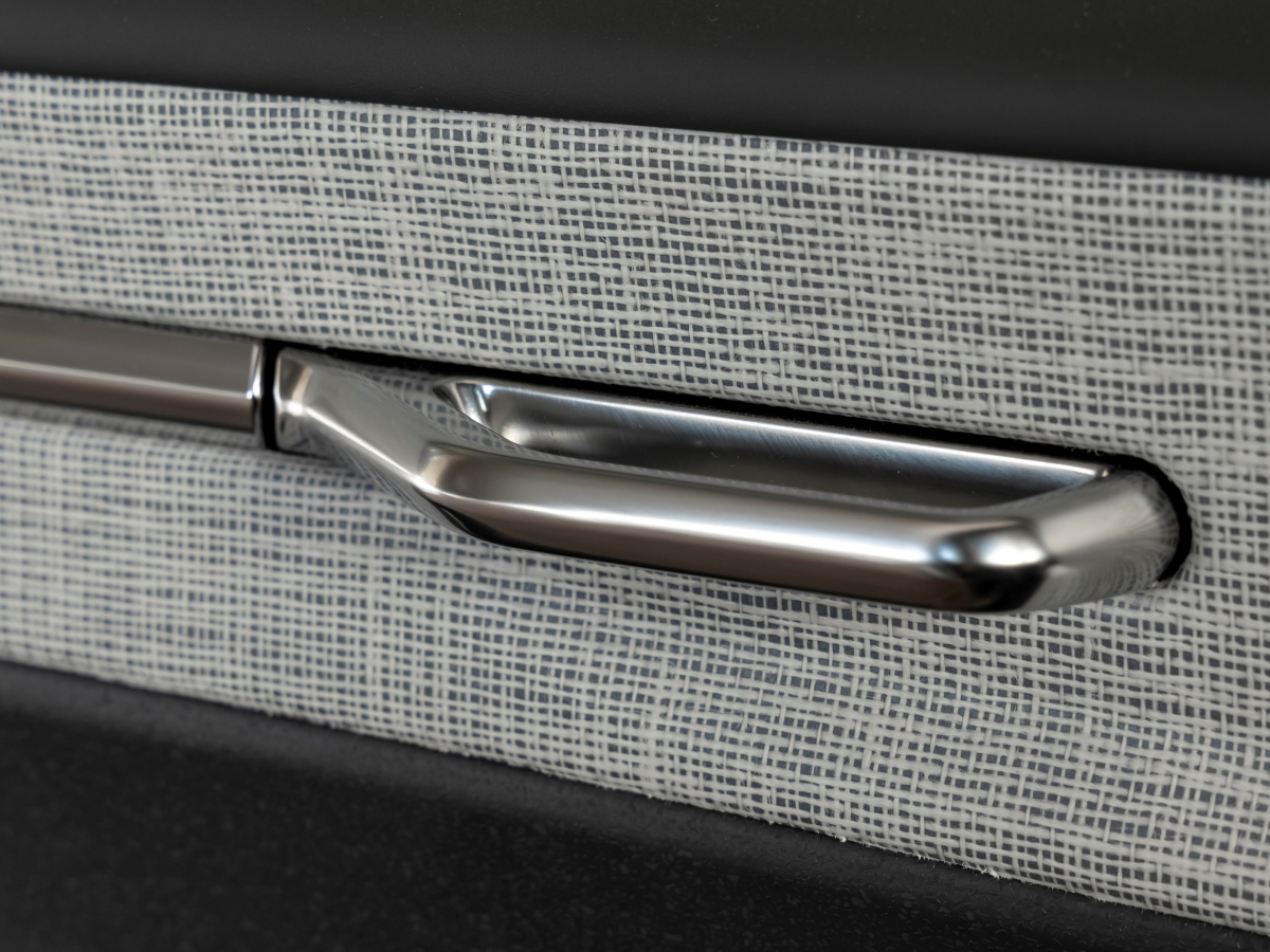 Interior door handle close-up of a Volvo EX30