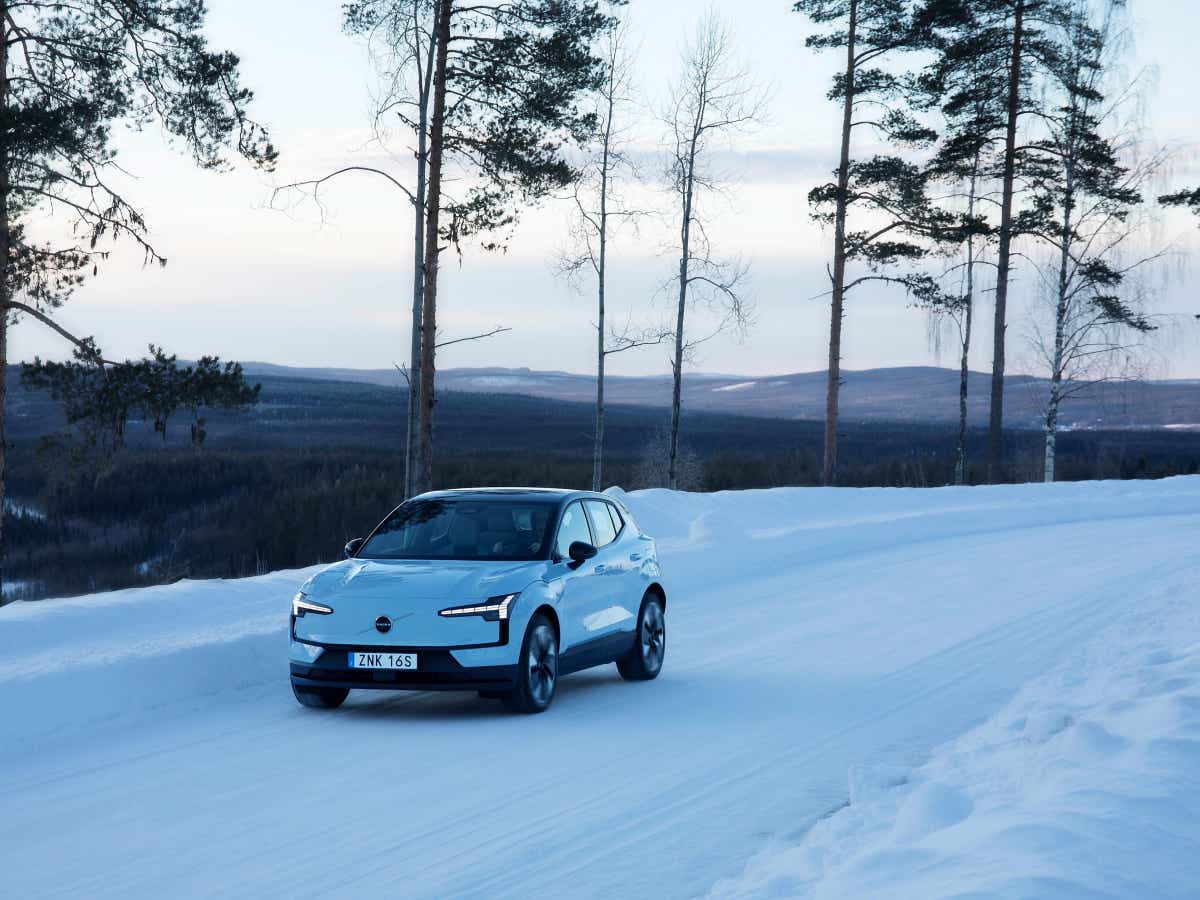 Front three-quarter view of a cold-blue Volvo EX30