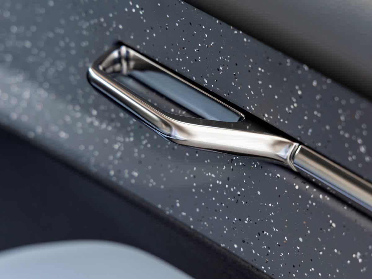 Interior door handle close-up of a Volvo EX30