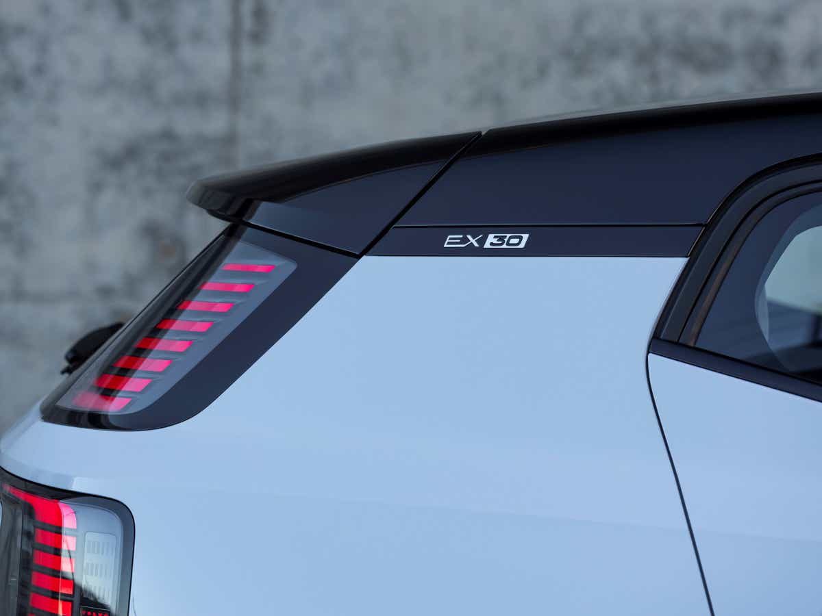 Rear quarter view of a crystal white Volvo EX30